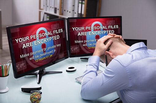 Stressed Businessman Sitting In Office